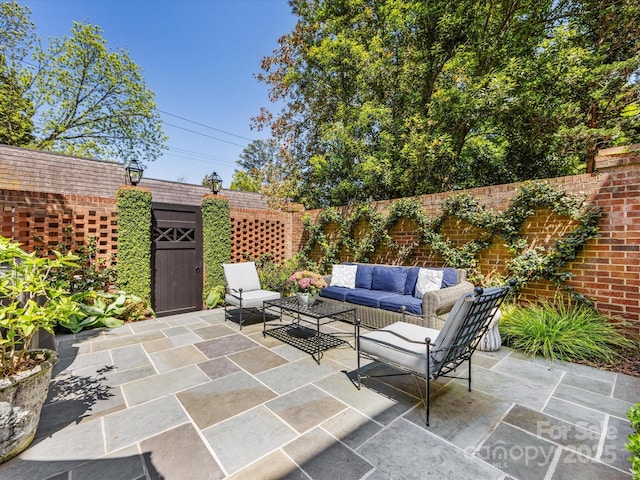 view of patio / terrace with outdoor lounge area and a fenced backyard