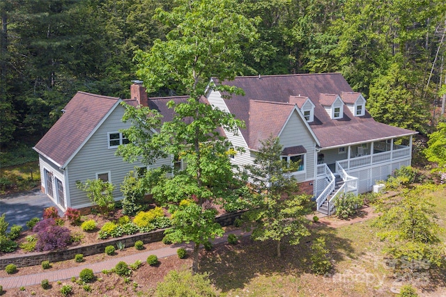 view from above of property featuring a heavily wooded area