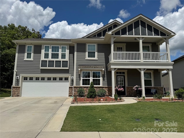 1205 Aiken Cross Ln, Indian Trail, NC 28079 - craftsman-style home featuring a balcony, driveway, stone siding, a porch, and a front yard