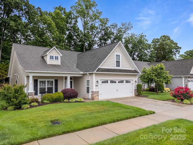 422 Drake Ln, Salisbury, NC 28146 - view of front of house with stone siding, driveway, a front yard, a garage, and roof with shingles