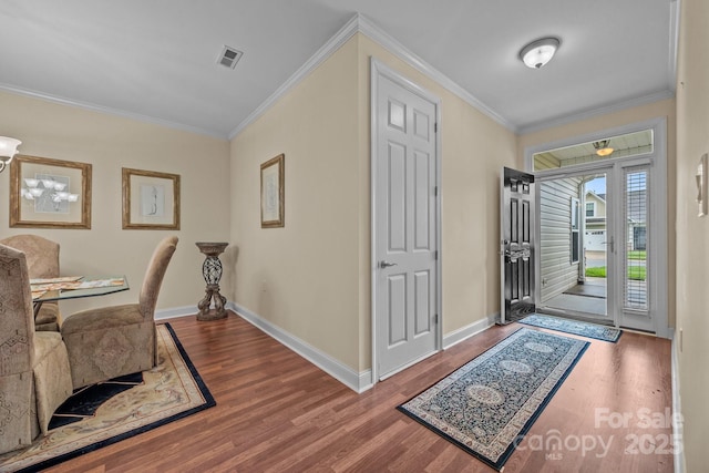422 Drake Ln, Salisbury, NC 28146 - entrance foyer with crown molding, wood finished floors, and baseboards