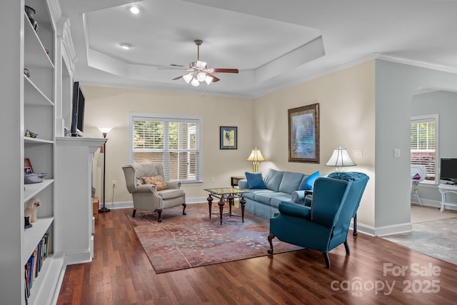 422 Drake Ln, Salisbury, NC 28146 - living area featuring arched walkways, wood finished floors, a ceiling fan, ornamental molding, and a tray ceiling