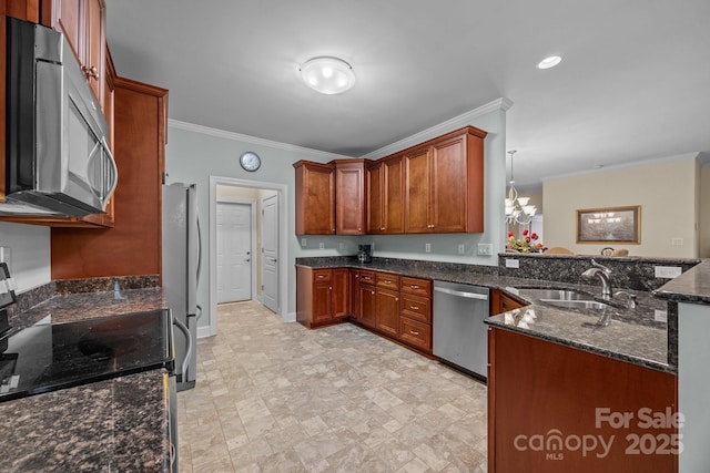 422 Drake Ln, Salisbury, NC 28146 - kitchen featuring stainless steel appliances, a sink, crown molding, a peninsula, and dark stone countertops