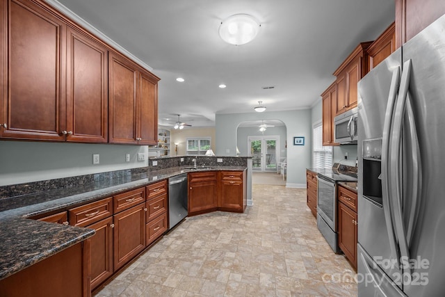 422 Drake Ln, Salisbury, NC 28146 - kitchen featuring appliances with stainless steel finishes, ceiling fan, arched walkways, a peninsula, and recessed lighting