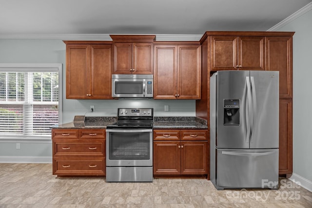 422 Drake Ln, Salisbury, NC 28146 - kitchen with stainless steel appliances, baseboards, crown molding, and dark stone countertops