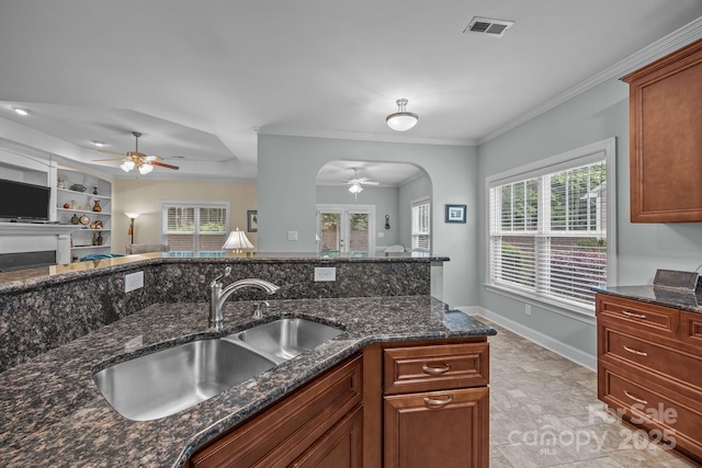 422 Drake Ln, Salisbury, NC 28146 - kitchen with ceiling fan, a sink, arched walkways, dark stone counters, and open floor plan
