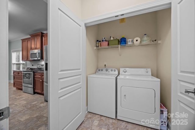 422 Drake Ln, Salisbury, NC 28146 - laundry room featuring separate washer and dryer, stone finish flooring, and baseboards