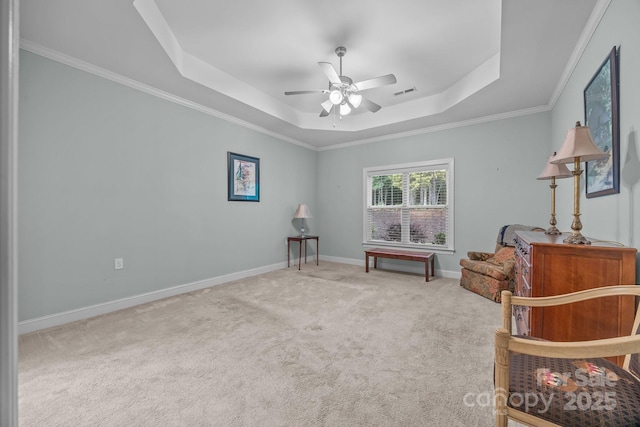 422 Drake Ln, Salisbury, NC 28146 - sitting room with a tray ceiling, carpet flooring, ceiling fan, baseboards, and crown molding