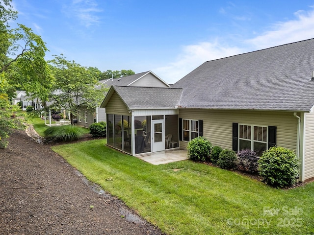 422 Drake Ln, Salisbury, NC 28146 - rear view of property with roof with shingles, a sunroom, a yard, and a patio area