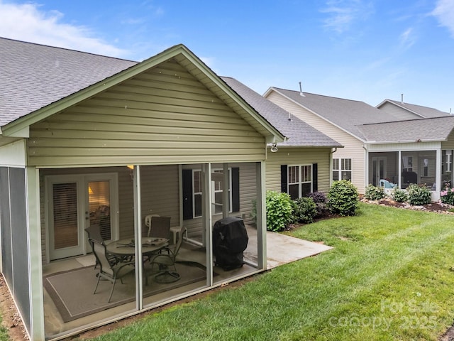 422 Drake Ln, Salisbury, NC 28146 - back of house featuring a shingled roof, a patio area, a yard, and a sunroom
