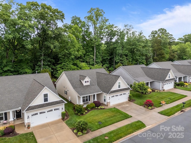 422 Drake Ln, Salisbury, NC 28146 - view of front of home with concrete driveway, a garage, and a front yard