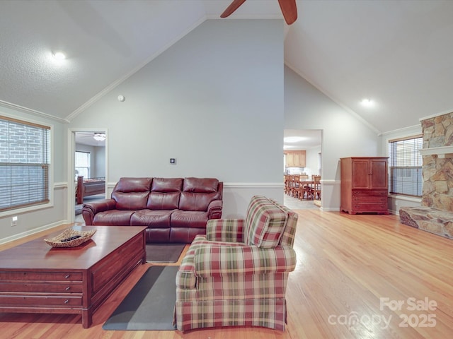 4620 Binwhe Ln, Gastonia, NC 28052 - living area with a ceiling fan, crown molding, light wood-style floors, high vaulted ceiling, and baseboards