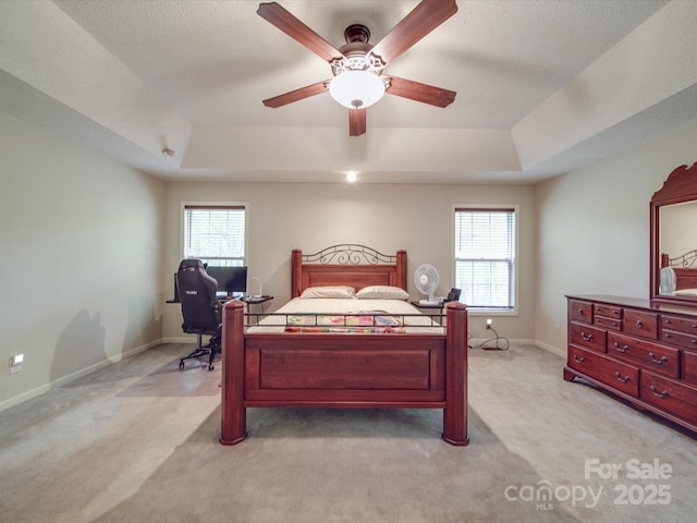 4620 Binwhe Ln, Gastonia, NC 28052 - bedroom featuring a raised ceiling, multiple windows, light colored carpet, and a desk