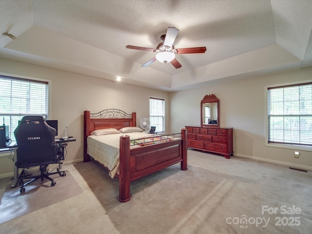4620 Binwhe Ln, Gastonia, NC 28052 - bedroom featuring a raised ceiling, light colored carpet, a desk, baseboards, and a ceiling fan