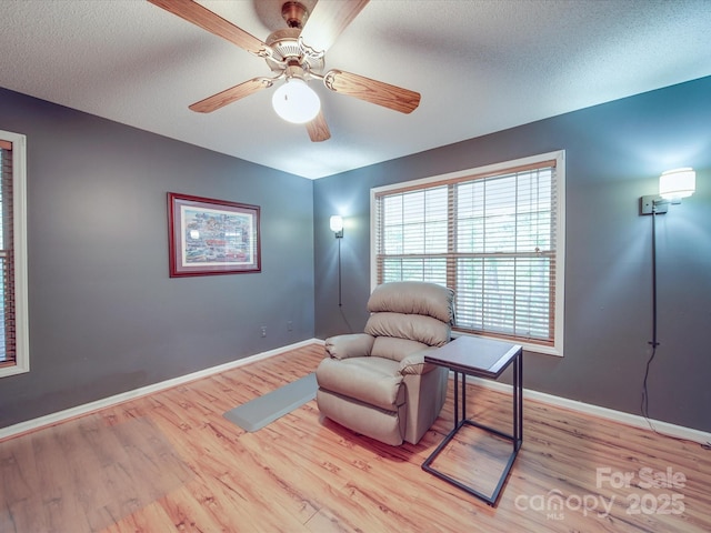4620 Binwhe Ln, Gastonia, NC 28052 - sitting room featuring light wood finished floors, baseboards, ceiling fan, and a textured ceiling