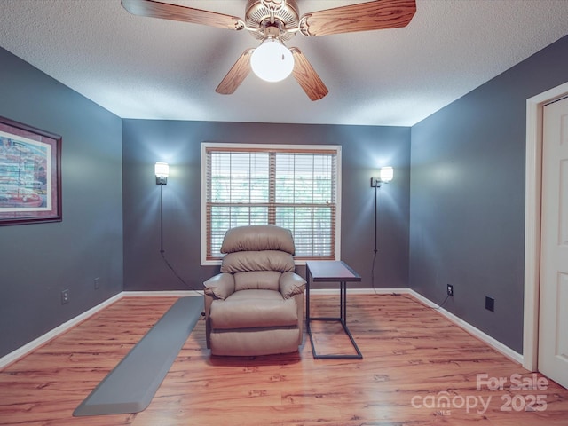 4620 Binwhe Ln, Gastonia, NC 28052 - sitting room featuring wood finished floors, a textured ceiling, baseboards, and a ceiling fan