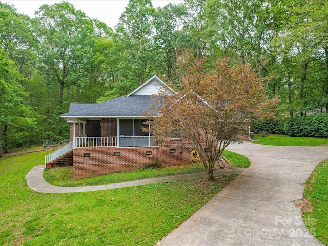 4620 Binwhe Ln, Gastonia, NC 28052 - view of front of home featuring a front lawn, brick siding, crawl space, driveway, and a shingled roof