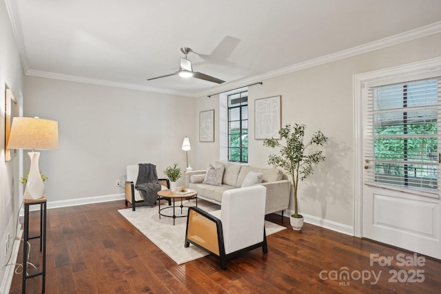 living room with wood finished floors, ornamental molding, a ceiling fan, and baseboards