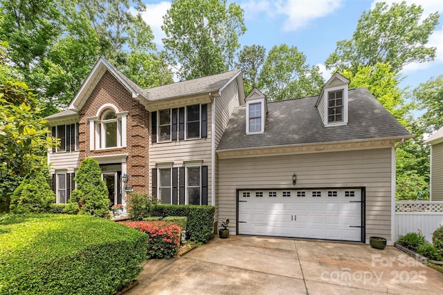 4846 Deer Cross Trl, Charlotte, NC 28269 - georgian-style home with concrete driveway, an attached garage, and roof with shingles