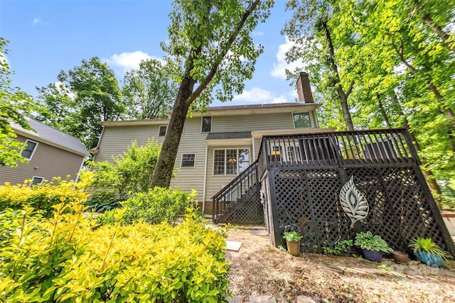 4846 Deer Cross Trl, Charlotte, NC 28269 - rear view of house featuring stairs, a chimney, and a wooden deck