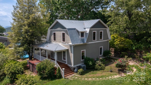 31 Jefferson Dr, Asheville, NC 28801 - view of front of property featuring a sunroom, a gambrel roof, and metal roof