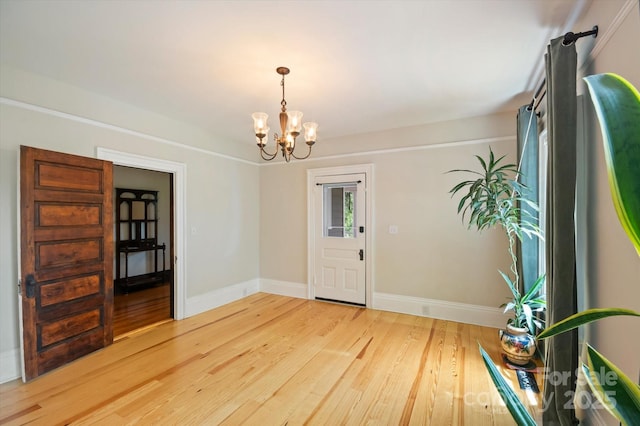31 Jefferson Dr, Asheville, NC 28801 - entrance foyer with a chandelier, light wood-type flooring, and baseboards