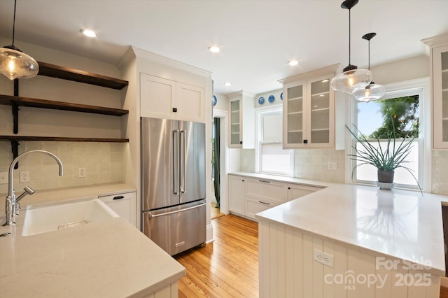 31 Jefferson Dr, Asheville, NC 28801 - kitchen with high end fridge, open shelves, a sink, light wood finished floors, and hanging light fixtures