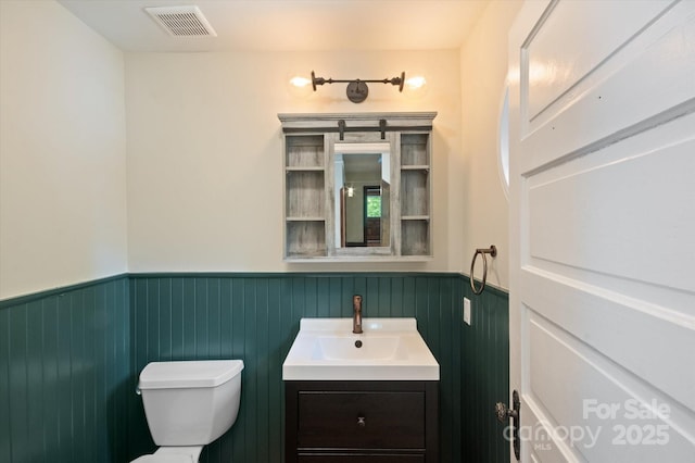31 Jefferson Dr, Asheville, NC 28801 - half bathroom with wainscoting, toilet, and vanity