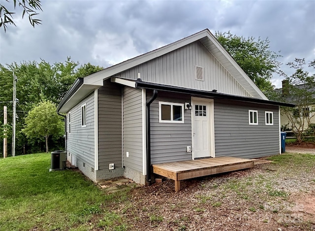 85 Archer St, Granite Falls, NC 28630 - back of property with a yard, cooling unit, crawl space, and board and batten siding