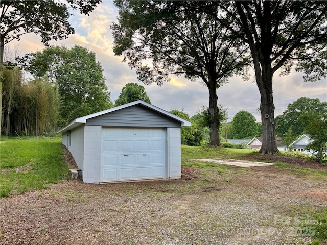 85 Archer St, Granite Falls, NC 28630 - garage at dusk with a detached garage and driveway