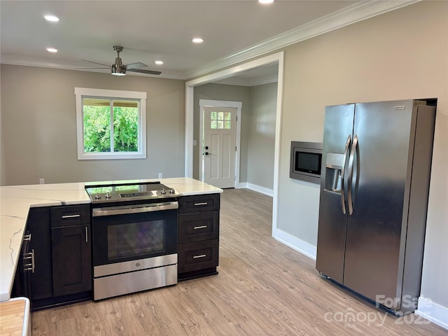 85 Archer St, Granite Falls, NC 28630 - kitchen with stainless steel appliances, crown molding, plenty of natural light, a ceiling fan, and light wood-style flooring