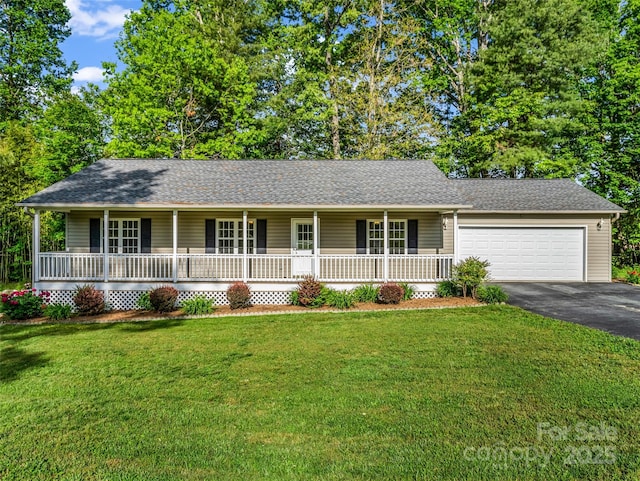 77 Simmons Dr, East Flat Rock, NC 28726 - single story home featuring a porch, asphalt driveway, an attached garage, a front yard, and a shingled roof