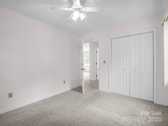 77 Simmons Dr, East Flat Rock, NC 28726 - unfurnished bedroom featuring carpet floors, baseboards, a closet, and ceiling fan