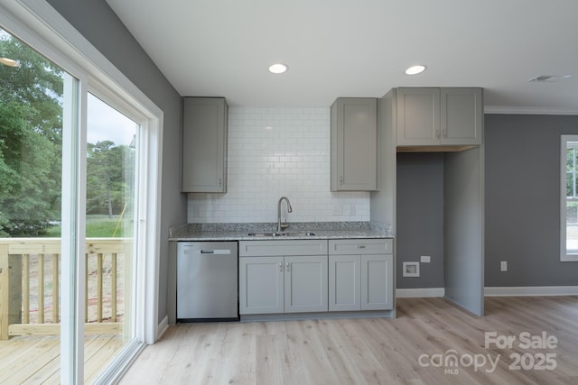 251 Hall Spencer Rd, Catawba, SC 29704 - kitchen with gray cabinetry, stainless steel dishwasher, a sink, light wood-style flooring, and tasteful backsplash