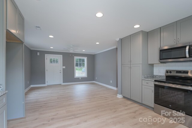 251 Hall Spencer Rd, Catawba, SC 29704 - kitchen with appliances with stainless steel finishes, gray cabinets, crown molding, ceiling fan, and backsplash