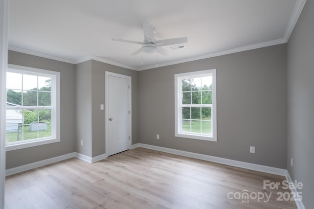 251 Hall Spencer Rd, Catawba, SC 29704 - unfurnished bedroom featuring multiple windows, light wood-style floors, ornamental molding, and baseboards