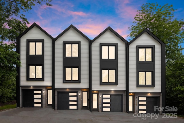 158 Mattoon St, Charlotte, NC 28216 - view of front of home with a garage and driveway