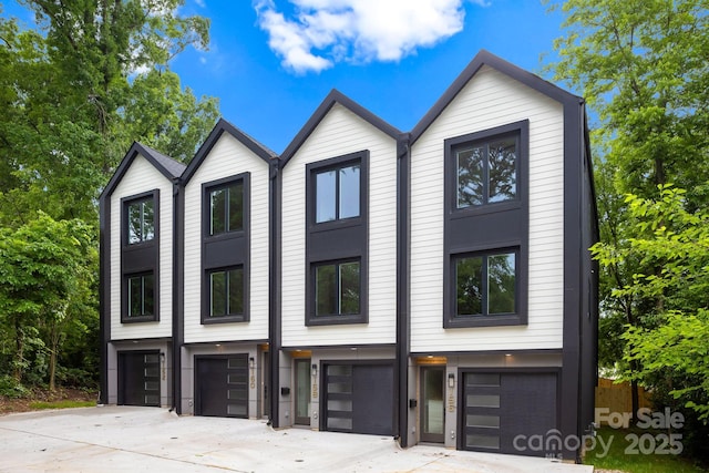 158 Mattoon St, Charlotte, NC 28216 - view of front of property with an attached garage and concrete driveway