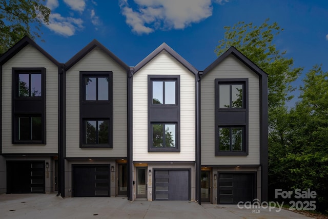 158 Mattoon St, Charlotte, NC 28216 - townhome / multi-family property featuring a garage and driveway