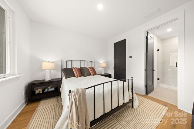 158 Mattoon St, Charlotte, NC 28216 - bedroom featuring wood finished floors, recessed lighting, ensuite bathroom, and baseboards