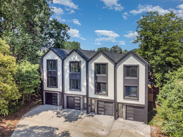 158 Mattoon St, Charlotte, NC 28216 - view of front facade featuring a garage and driveway