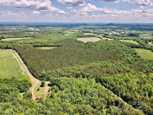view of rural area featuring a forest