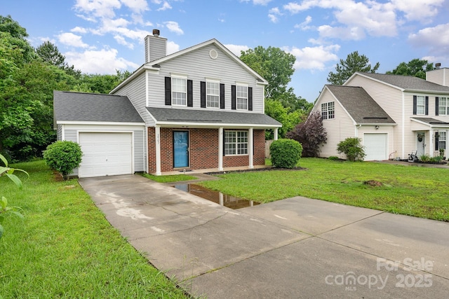 traditional-style house with an attached garage, a front lawn, a chimney, concrete driveway, and brick siding