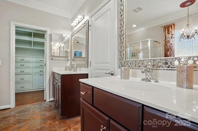 43041 Mimosa Ct, Fort Mill, SC 29707 - bathroom with a shower stall, a chandelier, ornamental molding, two vanities, and stone finish flooring