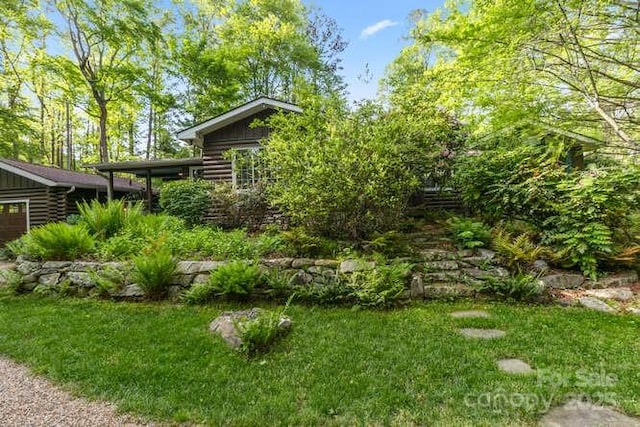 20 Deva Gln, Asheville, NC 28804 - view of grassy yard featuring a garage
