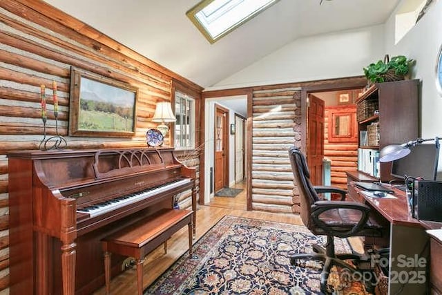 20 Deva Gln, Asheville, NC 28804 - home office featuring rustic walls, vaulted ceiling, light wood-style floors, and a skylight