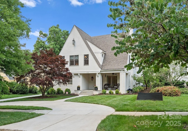 236 Wales Ave, Charlotte, NC 28209 - view of front of home with a porch, a front lawn, a ceiling fan, and a shingled roof