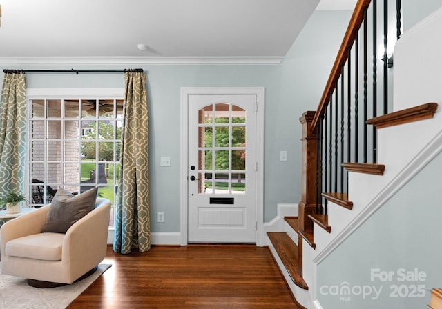 236 Wales Ave, Charlotte, NC 28209 - foyer entrance featuring wood finished floors, stairway, crown molding, and baseboards