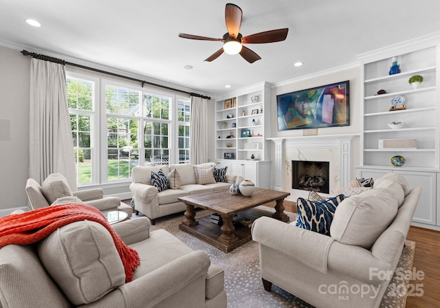 236 Wales Ave, Charlotte, NC 28209 - living room with a ceiling fan, recessed lighting, ornamental molding, a premium fireplace, and built in features