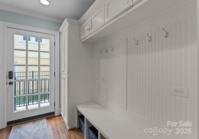236 Wales Ave, Charlotte, NC 28209 - mudroom featuring plenty of natural light, wood finished floors, and crown molding